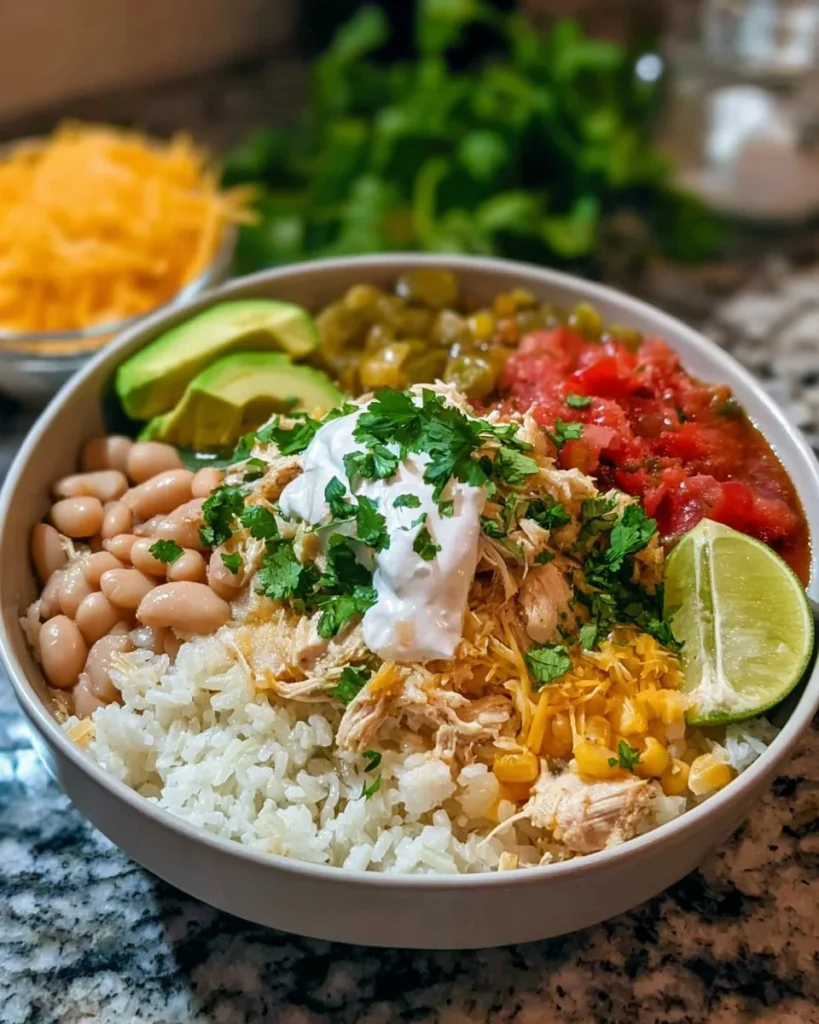 Delicious homemade white chicken chili burrito bowls served in a vibrant dish
