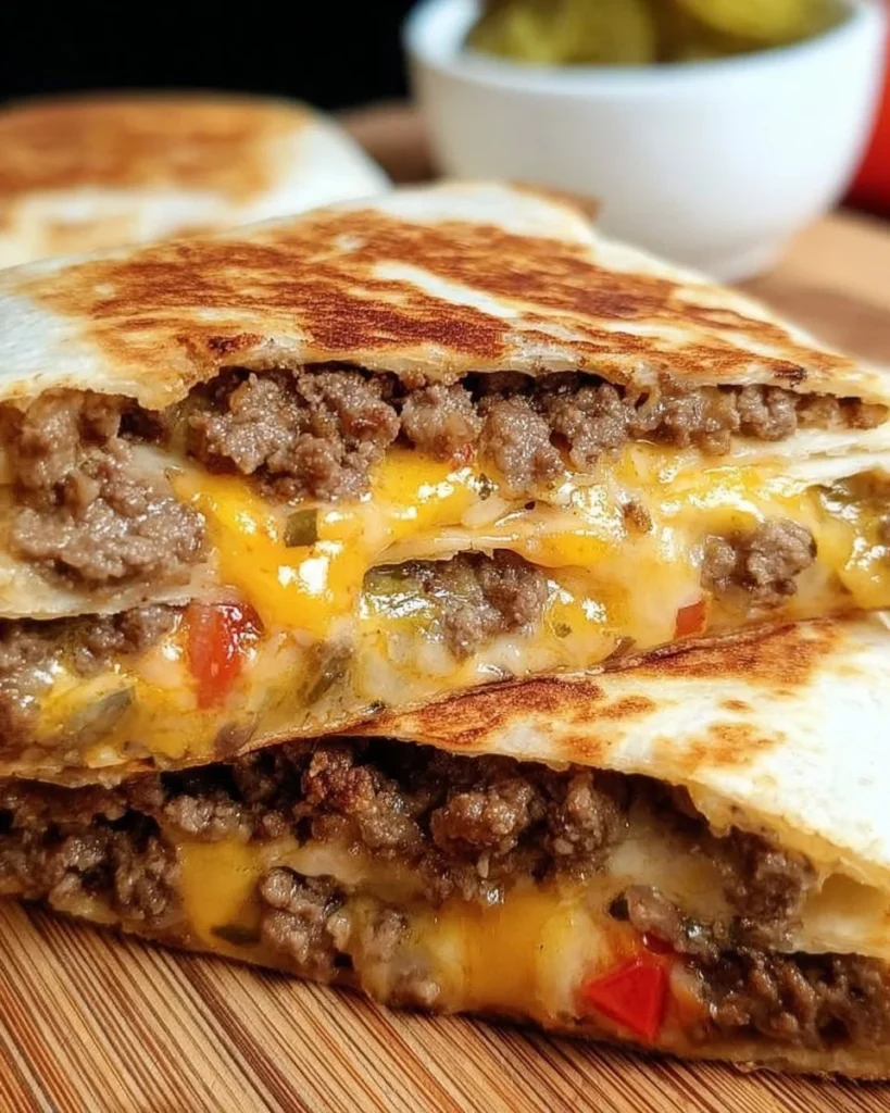 Sizzling Blackstone quesadilla burger with melted cheese and toppings
