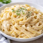 Delicious Fettuccine Alfredo with creamy sauce, Parmesan cheese, and garlic.