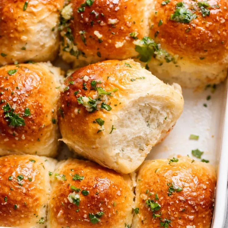 Delicious homemade garlic butter bread rolls brushed with garlic herb butter.